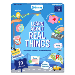 Skillmatics “Learn About Real Things” educational card set box for ages 7–14, featuring bright illustrations of real-world topics including startups with a lightbulb and rising graph, health insurance piggy bank with coins, credit card payment machine, visas stamp, GPS map pin, carbon footprint car, taxes form, cybercrime laptop, AI brain, and food labels, with “70 concepts” highlighted.