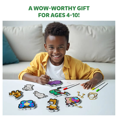Young boy happily coloring animal and object shapes with Aqua Puffs Animal Friends 3D Art Kit