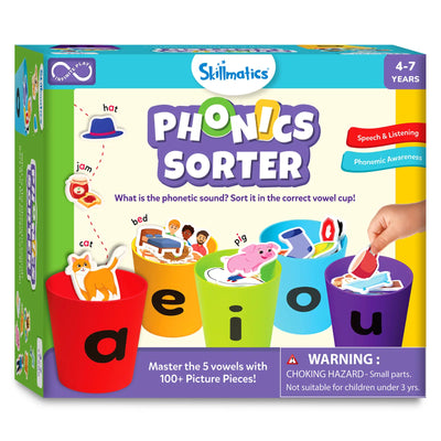 Front view of the Skillmatics Phonics Sorter game box for ages 4 to 7, featuring five large cups labeled a, e, i, o, and u filled with illustrated picture pieces like cat, bed, pig, and cup. Text explains phonetic sound sorting and mastering five vowels with over 100 picture pieces. The design highlights speech, listening skills, phonemic awareness, and hands-on early learning play.