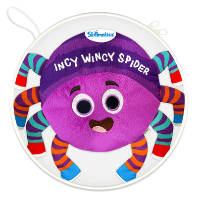 A close-up front view of the Incy Wincy Spider plush character centered inside circular packaging. The spider has a soft purple body, embroidered smiling face, large stitched eyes, and the product name embroidered above its head. Eight striped fabric legs in bright colors extend outward, showing soft, padded construction and varied textures designed for squeezing, grabbing, and sensory engagement by babies and toddlers.