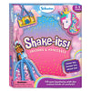 Front view of the Skillmatics “Shake-its! Unicorns & Princesses” activity kit box with a pastel sky background of clouds, stars, and sparkles. Illustrated foam shake-its include a unicorn head, a princess in a blue gown, and a castle filled with confetti. Visible elements include the Skillmatics logo, age range 4–9 years, a “Make ’em, shake ’em, wear ’em” badge, a rainbow graphic, and a choking hazard warning.