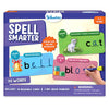 Front view of Skillmatics “Spell Smarter” spelling kit box for ages 4–7, featuring purple branding and sample write-and-wipe cards. Level 1 shows CVC word “cat” with kitten image, Level 2 shows word family “bell” with a ribboned bell, and Level 3 shows “block” with colored cubes. Text highlights 90 words, 45 reusable cards, 2 dry-erase markers, and choking hazard warning.