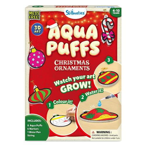 Skillmatics Aqua Puffs Christmas Ornaments 3D art kit packaging for ages 4-10. Shows festive ornament designs including bauble, gingerbread figure, teddy bear, candy cane, Santa, and striped ornaments. Includes steps to colour, add water, and watch art grow, with markers, water pen, string, and 8 Aqua Puffs.