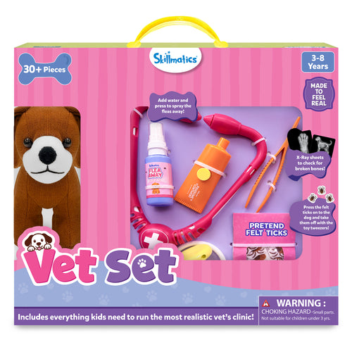 Skillmatics Vet Set toy packaging with a pink carry case design and large display windows. The box highlights 30+ pieces for ages 3–8, includes a realistic vet clinic playset with spray bottle, felt ticks, X-ray sheets, and plush puppy, plus carry handle and safety warning.
