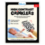 Skillmatics High Contrast Crinklers packaging for 0–12 months wearable sensory cloth toy. Shows baby on blue mat reaching toward hand holding black-and-white wavy crinkle cloth labeled CRINKLE. Includes logo, wear/play icons, crinkle sound note, and “8 patterns simple to complex” banner.