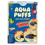 Front view of the Skillmatics Aqua Puffs activity kit box for ages 4–10, shown on a textured blue background. The title “Aqua Puffs” appears in large cream-colored letters with the subtitle “Just Cool Things.” Illustrated puff shapes include a rocket, guitar, sneakers, and a monster truck. Circular panels demonstrate three steps: coloring a foam shape, adding water with a pen, and watching the artwork expand into a raised 3D form.