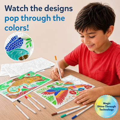 Child sitting at table smiling while using paint-over art markers on illustrated activity sheets, revealing bright colors through hidden patterns; multiple markers laid out on wooden surface and finished colorful animal designs visible beside ongoing coloring activity.