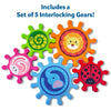 Set of 5 colorful interlocking plastic gears from Skillmatics Spinny Gears Animal Fun on a white background. Gears feature distinct animal illustrations: green caterpillar spiral, orange lion face, pink rabbit swirl, blue elephant, and red ladybug with black spots. Header reads 