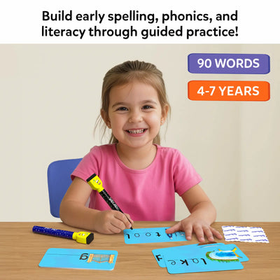 Smiling young girl seated at a table practicing spelling on blue write-and-wipe cards using a dry-erase marker. Visible word cards include simple phonics words, with another marker and cloth placed nearby. Text reads “Build early spelling, phonics, and literacy through guided practice,” alongside badges for 90 words and ages 4–7.