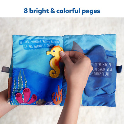 Open fabric baby book with undersea theme and interactive elements for infants
