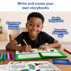 Young boy creating storybooks with craft supplies in the My Storybook Art Kit All My Adventures