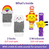Skillmatics Wriggle & Wonder set shown under “What’s Inside”: two striped socks, one with a rainbow and clouds and one with a cloud, plus two wristbands featuring a sun and star. Text lists sock and wristband sizes and notes crinkle and rattle sounds for sensory play.