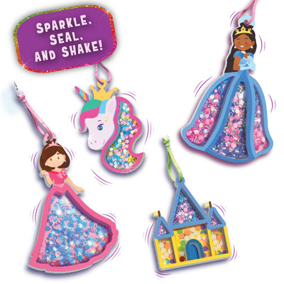 A purple background displays multiple completed foam shake-it keychains hanging with loops. Designs include a unicorn head with a crown, two princess figures in flowing dresses, and a castle, each filled with colorful confetti that appears layered and sparkling. A glitter-bordered label reads “Sparkle, seal, and shake!” with light star accents scattered across the background.