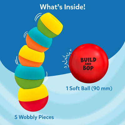 This image displays the Build And Bop toy contents against a blue background. Five multicoloured, wobbly pieces are shown stacked with motion lines indicating wobble, and a red soft ball labeled “Build And Bop” is placed to the right. The text reads “What’s Inside!” above, and lists “5 wobbly pieces” and “1 soft ball (90 mm)” beneath the illustrations.