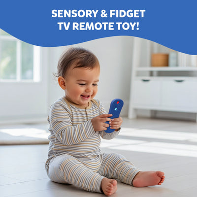 Baby sitting on a floor in a bright room smiling and playing with the Skillmatics Push & Pop TV Remote toy. The baby holds the colourful silicone remote while exploring the pop buttons. Text above reads 