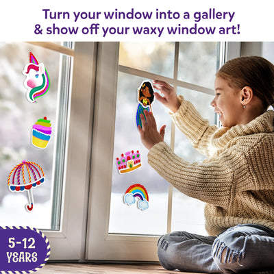 Young girl creating colorful window art decorations with Waxy Window Art for kids