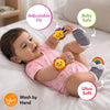 Smiling baby wearing Skillmatics Wriggle & Wonder socks and wristbands on hands and feet, with callouts for adjustable fit, baby safe and ultra soft. A hand-wash icon appears below, highlighting the product’s soft, wearable design for infant sensory play.