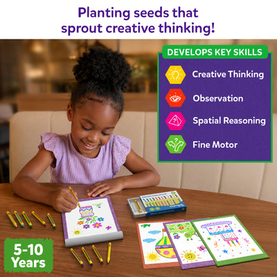 A young child sits at a wooden table using the Skillmatics Picture Sprouts activity book and coloring a drawing with retractable crayons. Additional completed pages and the crayon box are placed nearby. A side panel lists creative thinking, observation, spatial reasoning, and fine motor as key skills.