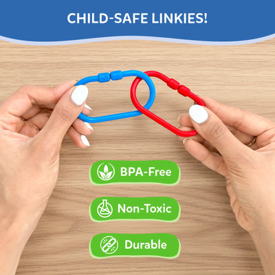 Two adult hands demonstrate how two plastic links connect, showing a blue and red link partially interlocked on a wooden surface. Above, text reads “Child-safe Linkies.” Below are green icons and labels indicating BPA-free, non-toxic, and durable materials, emphasizing safety, strength, and suitability for repeated toddler use.