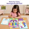 Young girl smiling as she places purple felt squares onto a fairy picture board at a table. Additional picture boards for a unicorn and hot air balloon design are displayed. Four labeled felt color sheets—Unicorn, Princess, Fairy, and Hot Air Balloon—are fanned out. Mess Free badge shown.