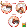 Step-by-step demonstration of Skillmatics Foil Fun Christmas Ornaments activity showing the peel, press and reveal process. Children remove adhesive backing, apply colourful foil sheets to ornament designs and create sparkling decorations using the craft materials provided.