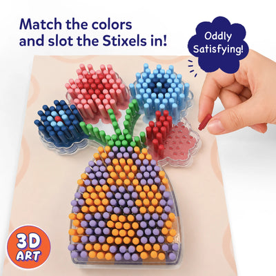 Close-up of the Skillmatics Stixels Flower Vase project showing colorful Stixels inserted into a transparent base to create flowers and a patterned vase. A hand places a red Stixel into an open slot while matching colors to the guide, highlighting the tactile 3D art-building activity.