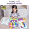 Young girl smiling as she places purple felt squares onto a fairy picture board at a table. Additional picture boards for a unicorn and hot air balloon design are displayed. Four labeled felt color sheets—Unicorn, Princess, Fairy, and Hot Air Balloon—are fanned out. Mess Free badge shown.