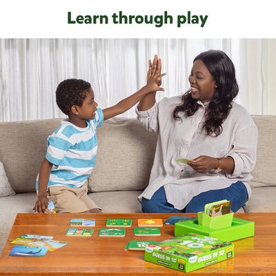 Mother and child playing Guess in 10 Junior World of Animals trivia card game