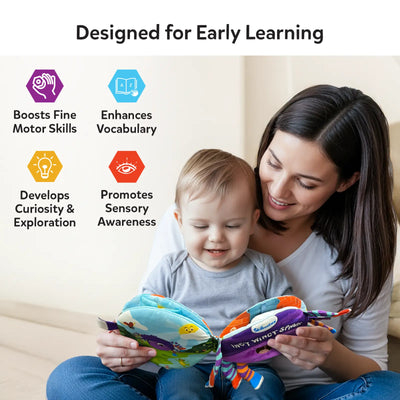 A mother and baby sitting together indoors, looking at and holding the Incy Wincy Spider sensory cloth book. The baby touches the soft pages while the parent supports the book. Icons and text highlight early learning benefits such as boosting fine motor skills, enhancing vocabulary, developing curiosity, and promoting sensory awareness. The scene emphasizes bonding, shared reading, and tactile exploration through soft fabric pages.