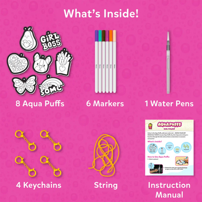 Flat lay on pink bubble background titled “What’s Inside!” showing kit contents: 8 black and white Aqua Puff cutouts including pear, Girl Boss text, fries, butterfly, dog face, rainbow and heart designs; 6 colored markers; 1 water pen; 4 gold keychain clips; yellow string; and printed instruction manual explaining steps and included items.