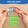 Two adult hands demonstrate how two plastic links connect, showing a blue and red link partially interlocked on a wooden surface. Above, text reads “Child-safe Linkies.” Below are green icons and labels indicating BPA-free, non-toxic, and durable materials, emphasizing safety, strength, and suitability for repeated toddler use.