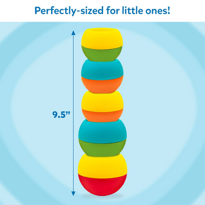 A tall stack of five colourful Build And Bop wobbly pieces is shown centered on a soft blue background with swirl patterns. A vertical arrow runs alongside the tower, marking its height as 9.5 inches. The pieces alternate in bright shades of yellow, green, teal, orange, and red. Text above the image reads “Perfectly-sized for little ones!”, emphasizing the easy-to-reach height for toddlers.