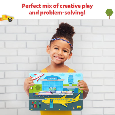 Young child holding colorful airport-themed puzzle from Tangram Twist Off We Go product