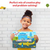 Young child holding colorful airport-themed puzzle from Tangram Twist Off We Go product
