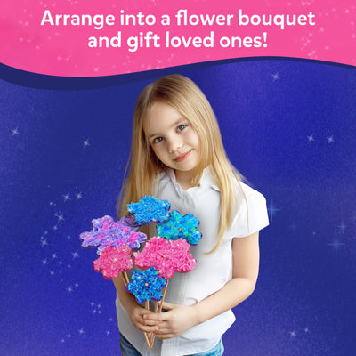 Young girl holding a colorful craft flower bouquet from Poke-in Art for Kids