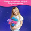Young girl holding a colorful craft flower bouquet from Poke-in Art for Kids