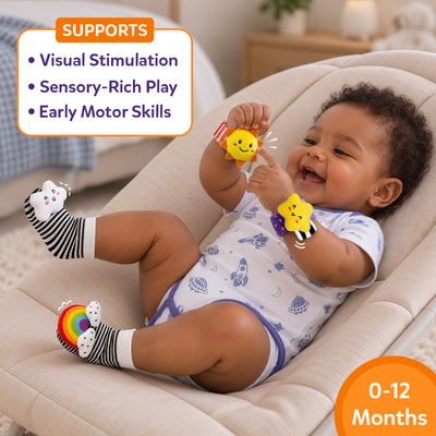 Baby wearing black-and-white striped socks and colorful crinkle wristbands while reclining in a cushioned seat and smiling at a wrist toy. A callout lists visual stimulation, sensory-rich play, and early motor skills, with a 0–12 months age badge in orange.