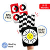 Skillmatics High Contrast Crinklers product visual showing three wearable sensory cloth crinklers stacked on a baby's hand: red-and-white concentric circle design, black-and-white wavy pattern, and black crinkler with a yellow smiling sun face. Includes BPA FREE badge, BABY SAFE badge, 0–12 Months label, and Wash by Hand icon.
