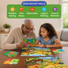 A grandfather and young child explore the Skillmatics Puzzle & Learn: All About Wild Animals set together at a table with a completed puzzle and learning boards. Icons highlight skills developed through play, including problem solving, fine motor skills, observation, logical thinking, and focus.