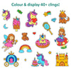 A white background display showing a wide assortment of colorful unicorns and princess-themed static clings under the heading “Colour & display 40+ clings!” The clings include unicorns, fairies, princesses, a teddy bear, rainbow, castle, carriage, crown, mirror, stars, hearts, moon, diamond, candy, popsicle, and small decorative icons, highlighting variety, playful design, and creative display possibilities.
