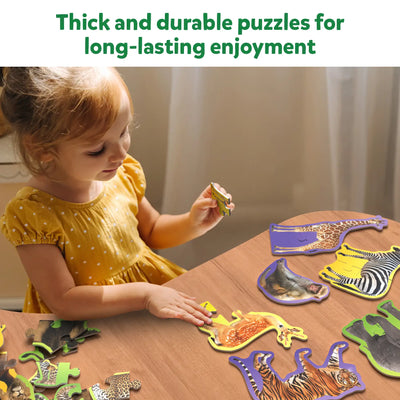 Young child playing with animal-shaped jigsaw puzzles from Step By Step Puzzle Wild Animals