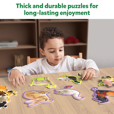 Child playing with durable farm animal-shaped puzzles from Step By Step Puzzle Farm Animals