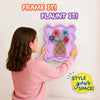 Child wearing a pink sweater hangs a completed Skillmatics Stixels Flower Vase artwork on a wall. The finished 3D design features colorful flowers and a patterned vase mounted inside a lavender decorative frame, demonstrating how the craft transforms into personalized wall décor for a bedroom or playroom.