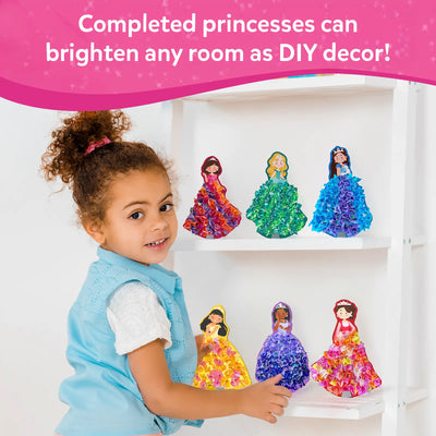 Young girl showcasing handcrafted magical princess figures from Poke-in Art for kids