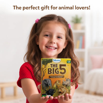 Young girl joyfully presenting The Big 5 African animals themed card game