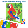 Close-up of a macaw picture board partially filled with colorful felt squares matched to dotted color guides. The red bird sits on a branch with a tree in the background. A strip of felt squares labeled “MACAW” and loose red, blue, green, and yellow pieces appear below. Text reads “Match the felt squares by color!”