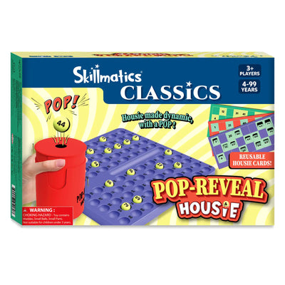 Front view of the Skillmatics Classics Pop-Reveal Housie box. The design shows a hand holding a red pop-reveal can popping out a yellow ball, a blue number tray filled with balls, and colorful reusable housie cards. Text includes “Housie made dynamic, with a POP,” age range 4–99, 3+ players, and a choking hazard warning.