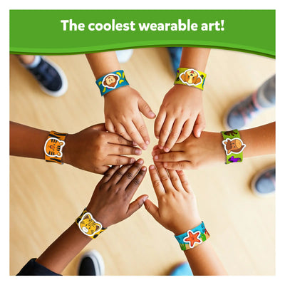 Children’s hands wearing colorful animal-themed Snap Bandz bracelets for DIY craft activity