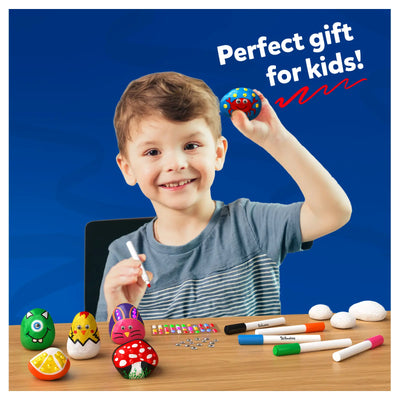 Boy holding painted rock with rock painting supplies in the Crafty Playtime Bundle