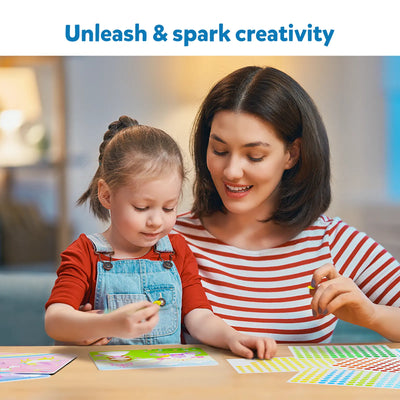Young girl and woman creating sticker art with Dot it Unicorns & Princesses kit